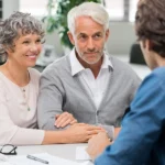 Senior couple consulting with lawyer