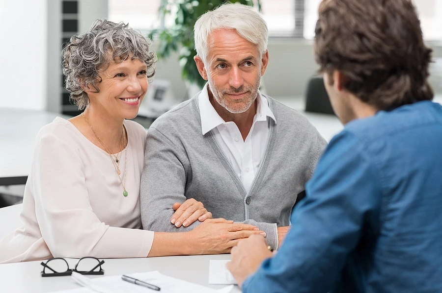 Senior couple consulting with lawyer